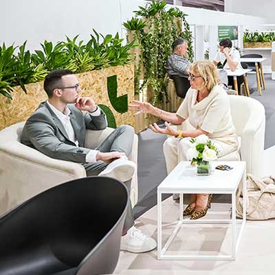 Male and Female attendees networking at WHX Dubai