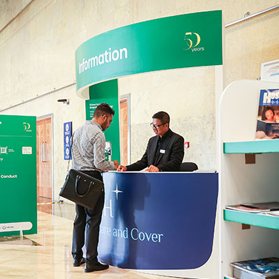 Image of WHX Dubai Venue and attendee registering on entrance