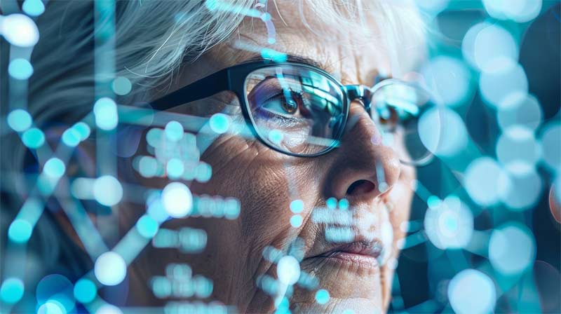An image of an elderly female looking at an AI screen