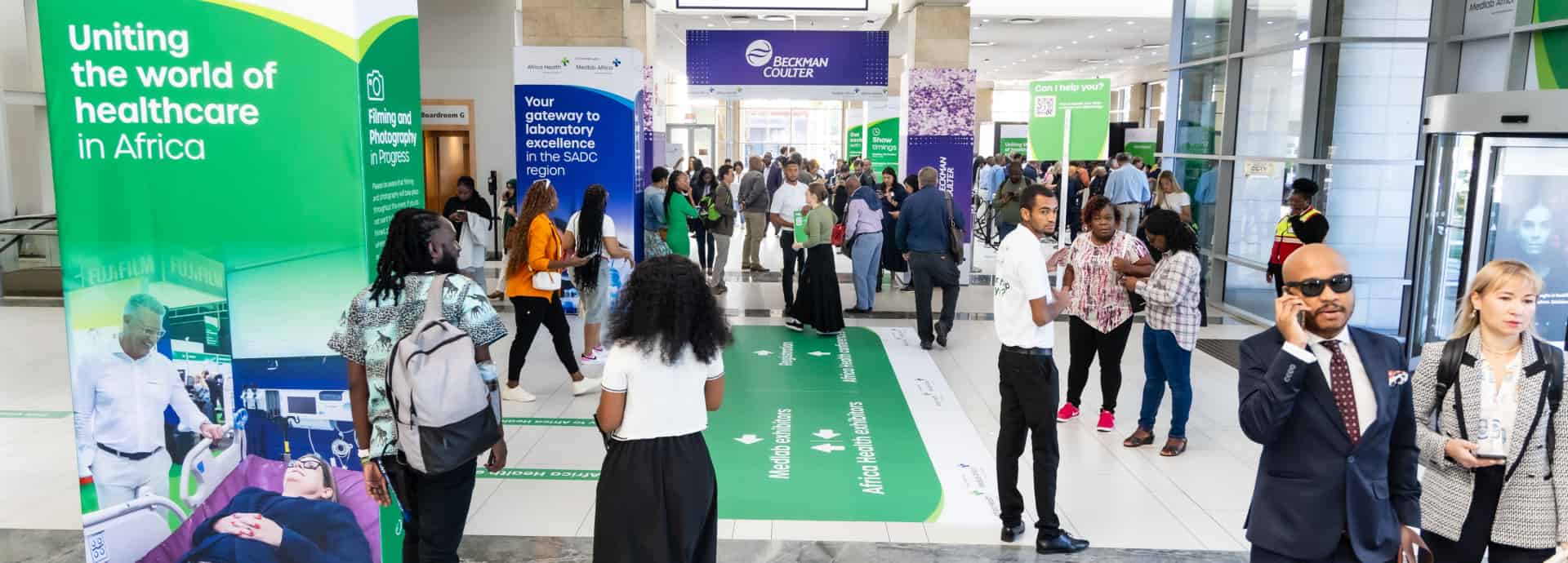 Exhibitor explaining his product at World Health Expo Cape Town.