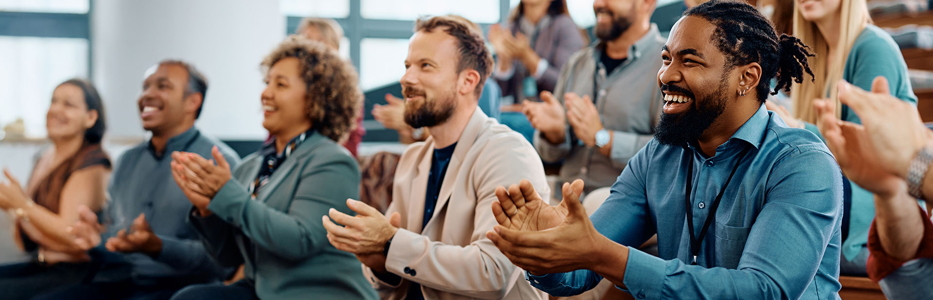 Audience listening to speakers on stage