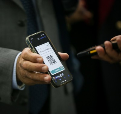 Visitor badge QR code being scanned for entry