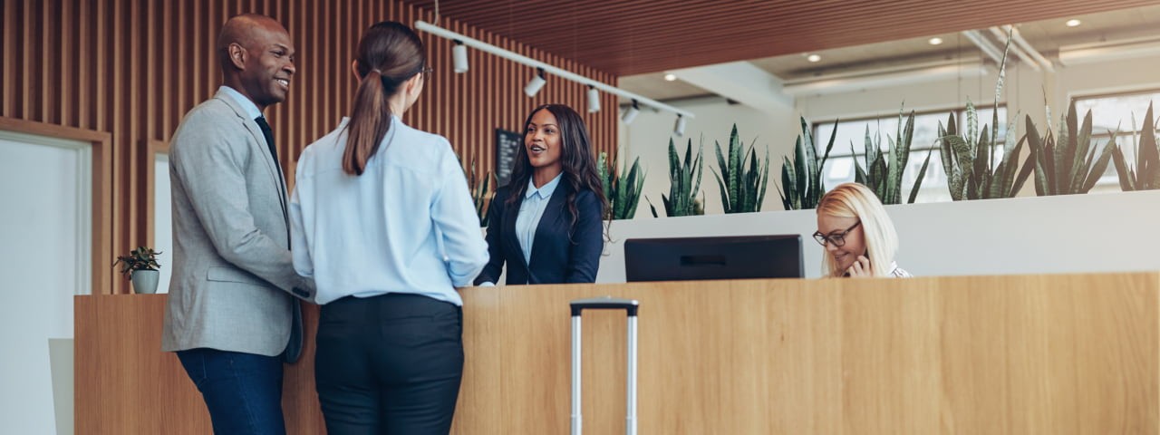 Visitors checking into a hotel